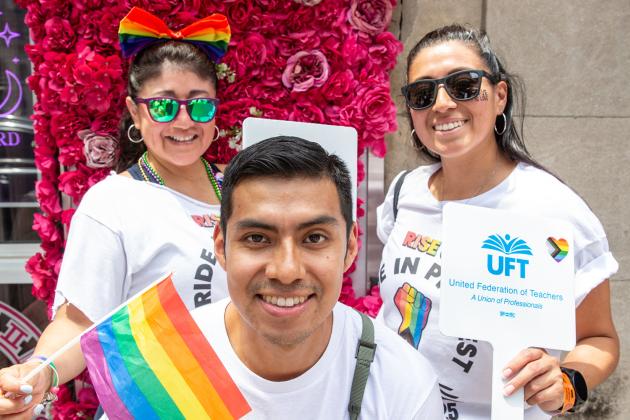 UFT Members marching in the 2025 NYC Pride March smile for a photo. 