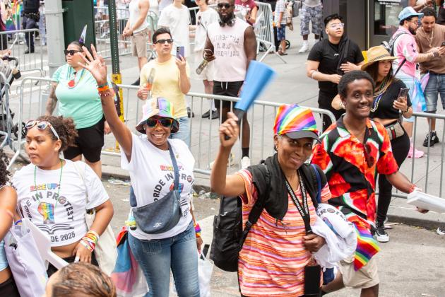 UFT members wave as they march alongside the union’s float at the 2025 NYC Pride March. 