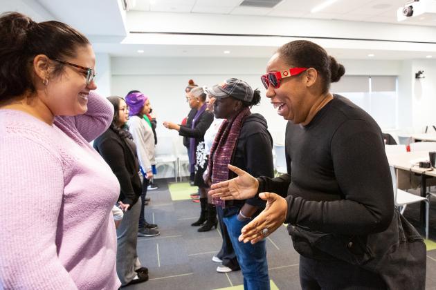 Parents Andrea Daniels (left) and Donna Bailey-Copeland work through emotions during a grief exercise in a workshop titled, “Through the Storm.”