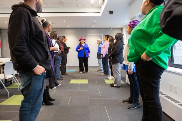 Presenter Dalisha Rodriguez (center) leads participants through an activity during the “Through the Storm” workshop.