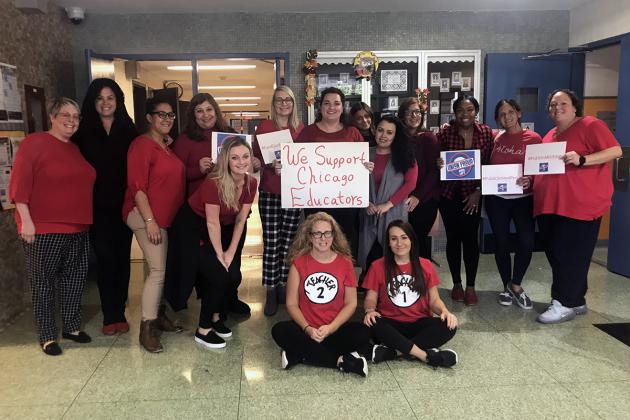 Group of UFT members wearing red