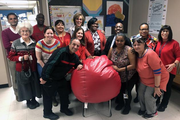 Group of UFT members wearing red