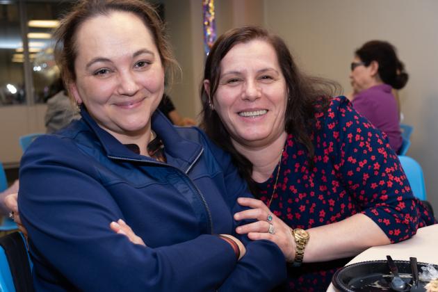 School nurse colleagues take a photo while seated at a table during the 2025 UFT School Nurses Appreciation Dinner at UFT headquarters. 
