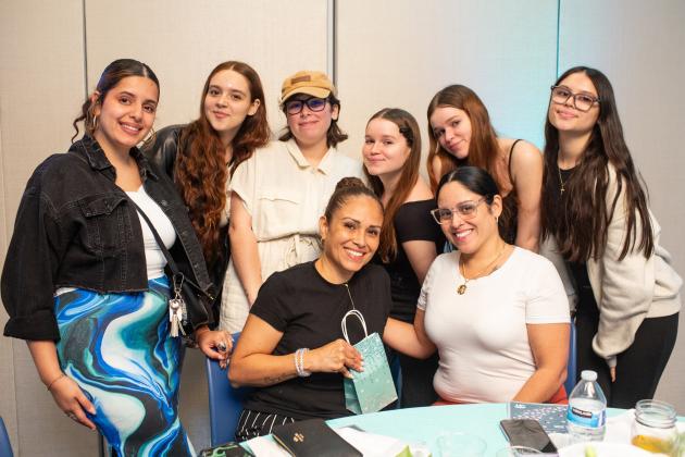 School secretary Lucrecia Ochs (bottom left), an honoree from PS 201 in Queens, is surrounded by her family at the UFT School Secretary Awards Soiree on June 6, 2025. 