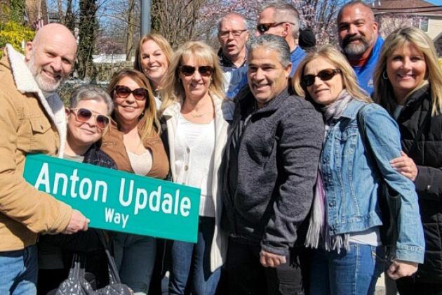 Family and friends of IS 34 teacher Anton Updale at the renaming of the street where he grew up.