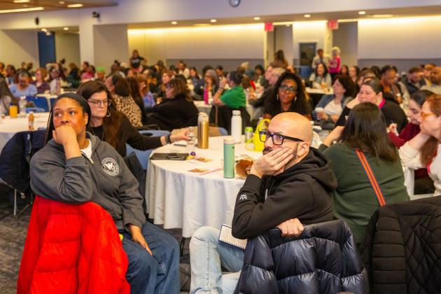 School social workers listen intently to various presenters featured during the event.