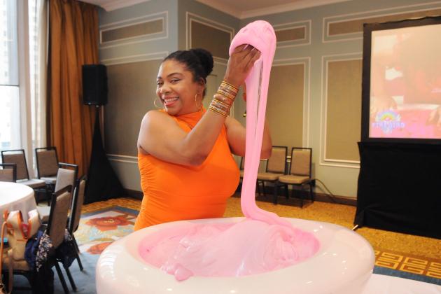A paraprofessional in attendance at the UFT Spring Education Conference explores the educational possibilities of slime as part of a series of museum and career and technical education exhibits.