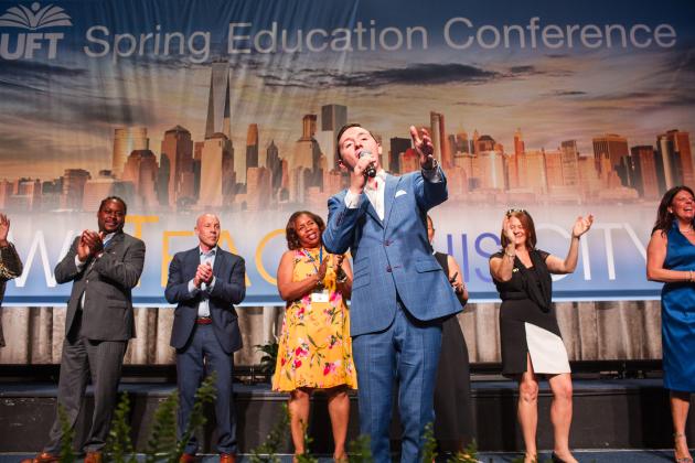 Charlie Romo, an “American Idol” contestant and a social studies teacher at New Dorp HS on Staten Island, wows the crowd with his rendition of “New York, New York" at the 2025 UFT Spring Education Conference. 
