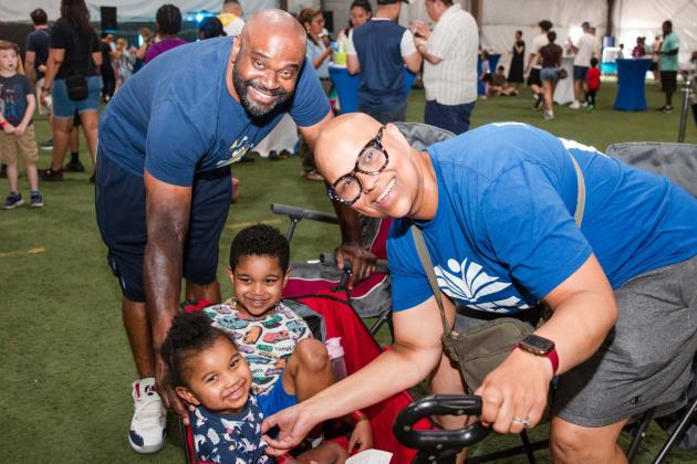 Physical education teacher Teresa Rodriguez-McGill, chapter leader at PS 183 in Queens, enjoys UFT Family Day with her husband, Michael McGill, who teaches at Liberty Avenue MS in Brooklyn, and their children.