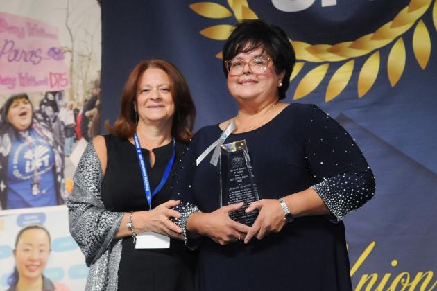 Brenda Caquias (right), assistant chapter leader of the Speech Improvement Chapter, receives the Sidney Harris Award for her leadership in special education from UFT Vice President for Special Education Mary Jo Ginese.