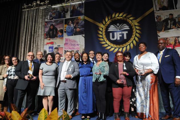 Congratulating Marsh/Raimo Award winners Dina Barghouti, Vernetta Crowner-Deshommes, Avi Gvili, James Rodriguez, Genoveba Smith and Winnie Thompson for their political activism are union leaders including UFT Political Director Vanecia Wilson (center), Mulgrew (fourth left) and Barr (right).