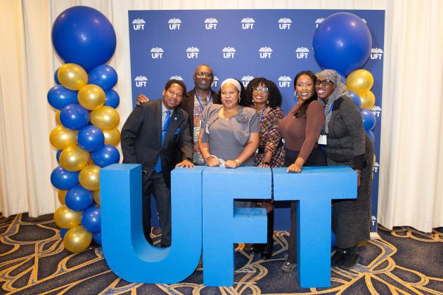 Members of District 18 strike a pose at the UFT photo booth with Brooklyn District Representative Joseph Surpris (far left).  