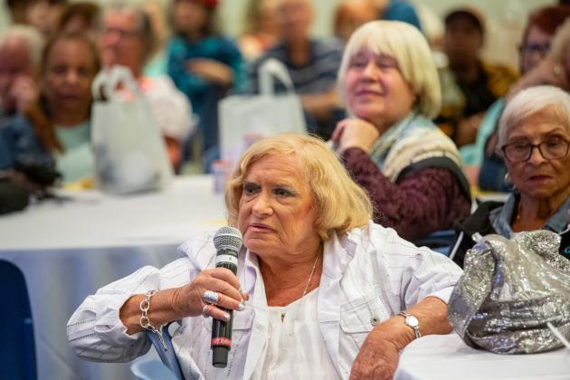 A UFT retiree in attendance at the 30th annual Day at the University asks a question following the keynote address.