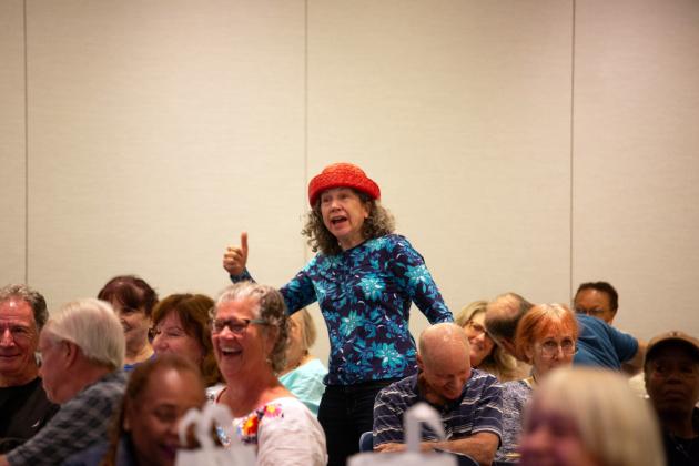 A retiree in attendance makes guests laugh during the 30th annual UFTWF Day at the University. 