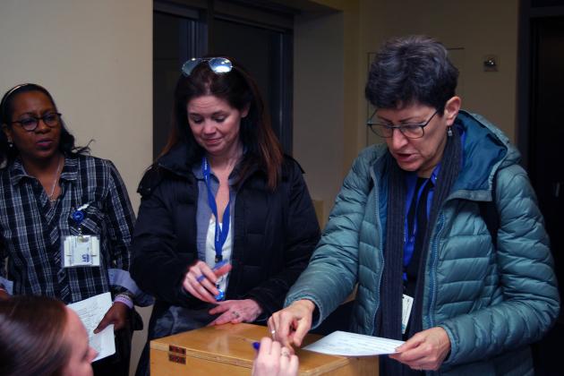 Two UFT nurses placing ballots in box