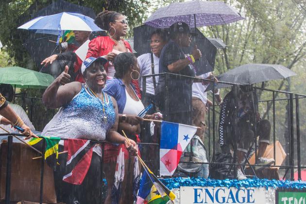 People holding umbrellas on UFT float