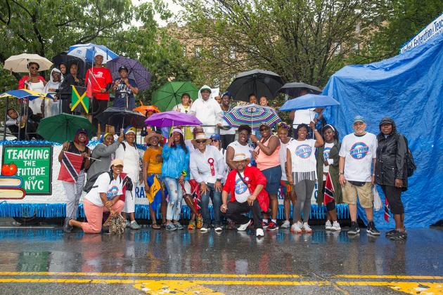 Large group of UFT members in front of UFT float