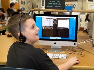 Students learn advanced skills such as HTML coding in the computer lab.