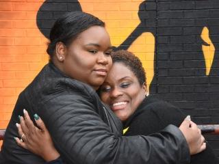 Tabitha Collins (left), Demetrius’ sister, embraces Steward.