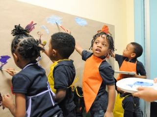 Prekindergartners create a mural based on the story “Maybe Something Beautiful.”