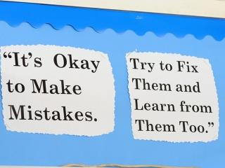 bulletin board displaying text "It's okay to make mistakes. Try to fix them and learn from them too." -Daniel Tiger