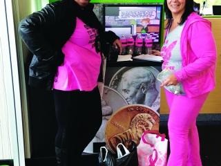 Andrea Gomes (left) and Carmela McCann at the bank’s coin machine.