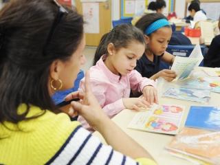 Vargas reads to her students in Spanish.