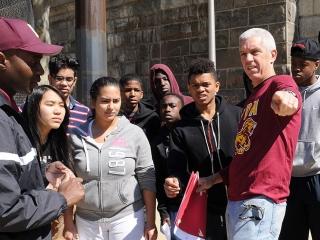 Mangan (third from right) directs the cleanup. 