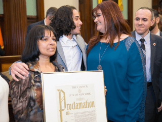 Ramos (center) celebrates with Steinweiss (right) and his mother Mildred Ramos (