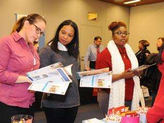 Picking up information at the Apex Learning table are (from left) Lydia Santana,
