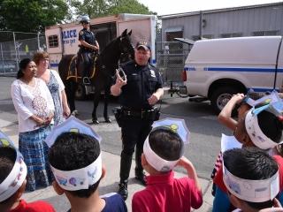 Students learn about Lucky as paraprofessional Selina Khanam (left) and teacher 