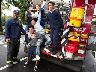 Students get to check out a fire truck when the firefighters stop by.