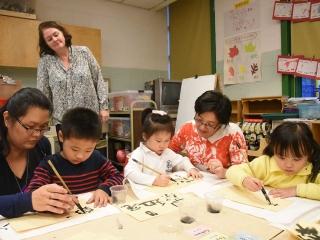 Learning leader Chee Fong Chia (left) and teacher Astrid Li teach students how t