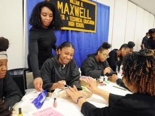 William H. Maxwell HS students provide manicures.