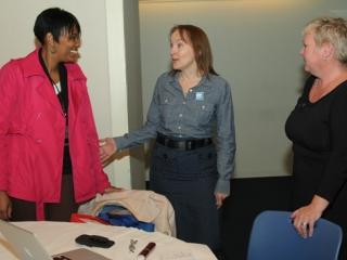 Tanisha Franks (left), the UFT educational liaison for Staten Island, speaks wit