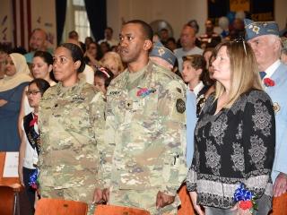 Army veterans stand during the ceremony.
