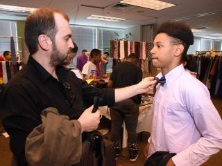 Teacher A.J. Gjikola of MS 582, Brooklyn, approves of the bow-tie selection.
