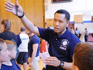 PS 214 physical education teacher Ed Acampado calls out instructions to the Blue