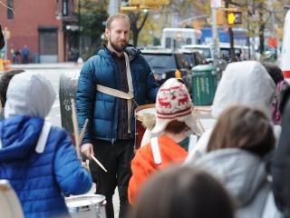 Campbell makes sure his drummers stay in line en route to the church.