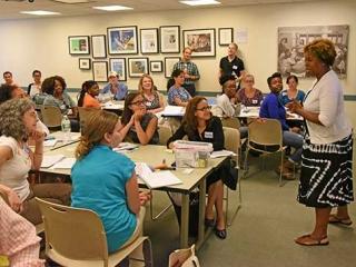 UFT Vice President for Elementary Schools Karen Alford (standing, right) engages