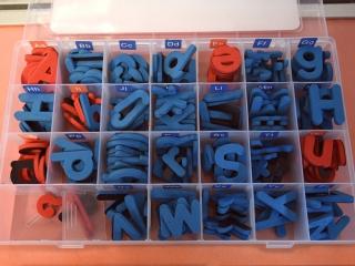 Students use an assortment of letters to “build” words and promote literacy.
