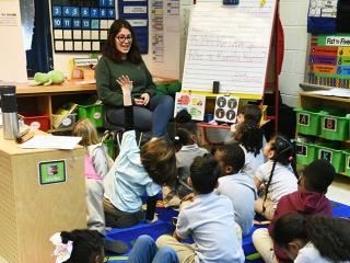 Some 1st-graders find it easier to listen to their teacher, Anna Battaglia, whil