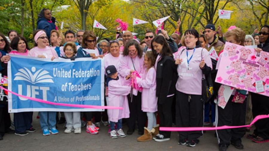 Ellie Engler cuts the ribbon to start the walk with UFT survivors