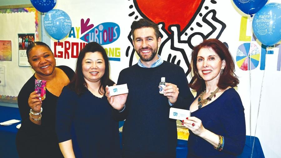 Showing off their UFT gifts are PS 171 teachers (from left) Jeneena Hubbard, Chapter Leader Kelly Kim, Steven Mann and Halli Moskowitz. 