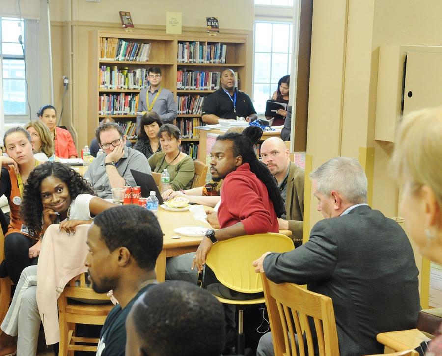 Staff from Madison, Midwood and Murrow high schools pack the Madison HS library.