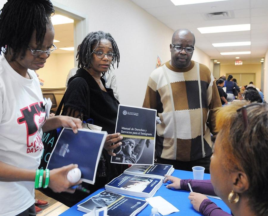 Bronx parents picked up information about immigration law in the exhibitor hall.
