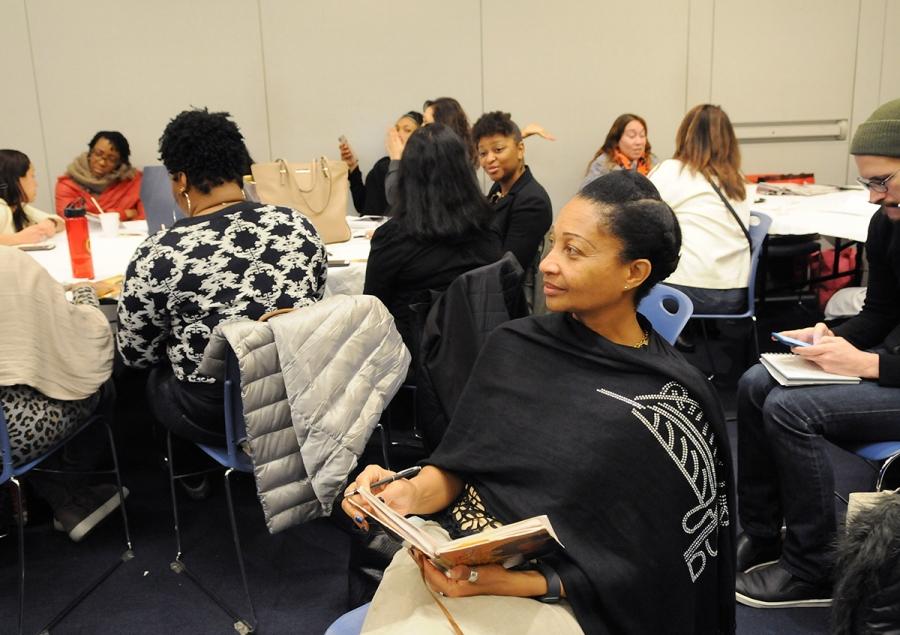 Social worker Euphemia Taylor of PS 21 in Brooklyn takes notes during a workshop.
