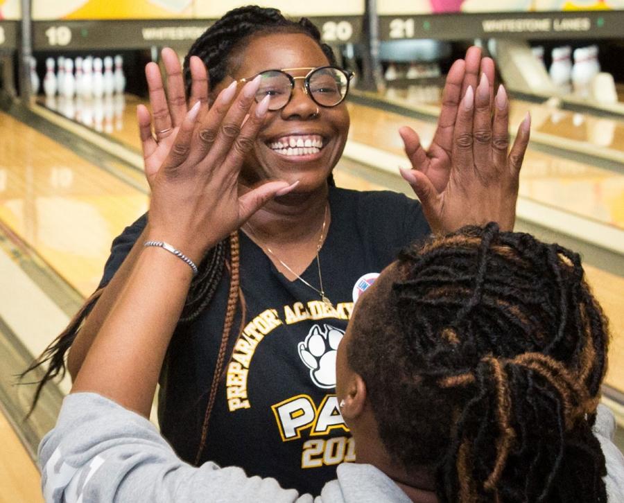 Kidra Dandridge (facing the camera) of Preparatory Academy for Writers gets a hi