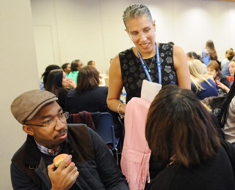 Rosemarie Thompson (standing), the chapter leader of the School Counselors Chapt