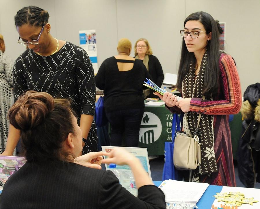 Counselors and aspiring counselors browse tables at the vendor fair. This year’s